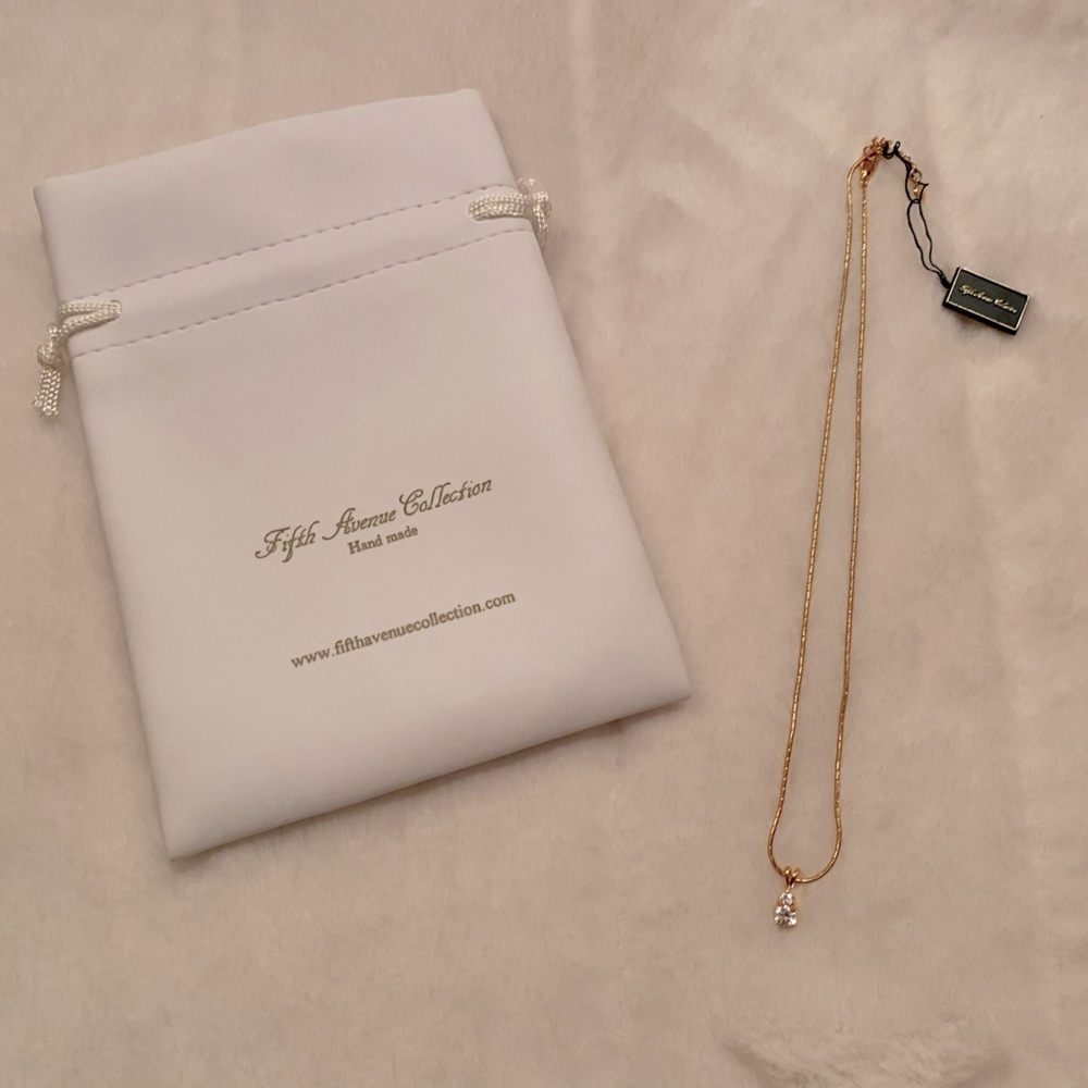 Fifth Avenue Collection “diamond” solitaire pendant on gold tone necklace